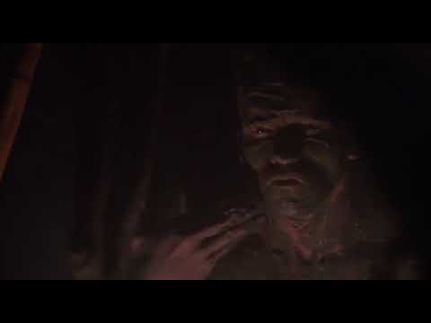 Arnold Schwarzenegger smearing mud on his face
