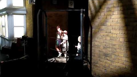 Platform 9 & 3/4 walking through the wall effect wizarding world of Harry Potter Orlando Florida