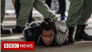 Dozens of people have been arrested in hong kong, including a man
carrying pro-independence flag, after new "anti-protest" law imposed
by beijing came in...