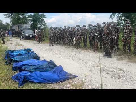 Nepal's authorities bury unidentified bodies in mass trenches amid space limits and health risks