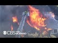Flames from gas explosions engulf 60+ structures in 3 Mass. towns