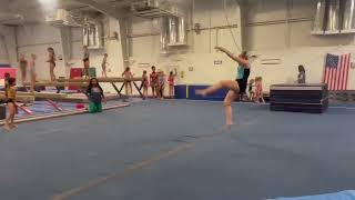 Front tuck step out round off back handspring layout