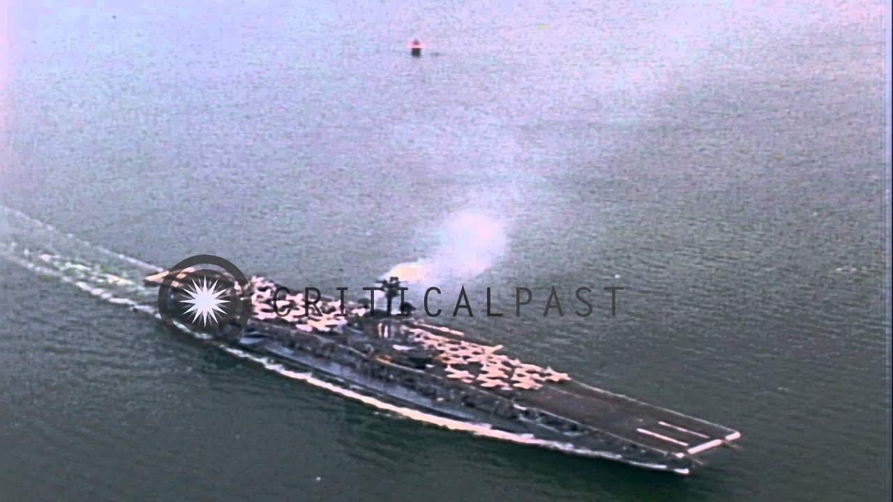 A Merchant Ship passes the USS Intrepid (CVS-11) underway at a sea in the United ...HD Stock Footage