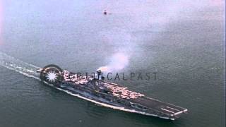 A Merchant Ship passes the USS Intrepid (CVS-11) underway at a sea in the United ...HD Stock Footage