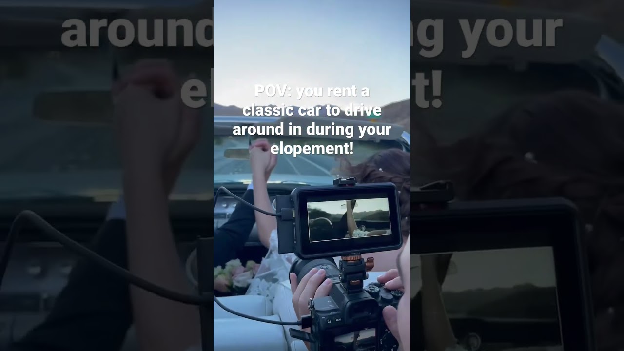 Couple rides in classic car during wedding