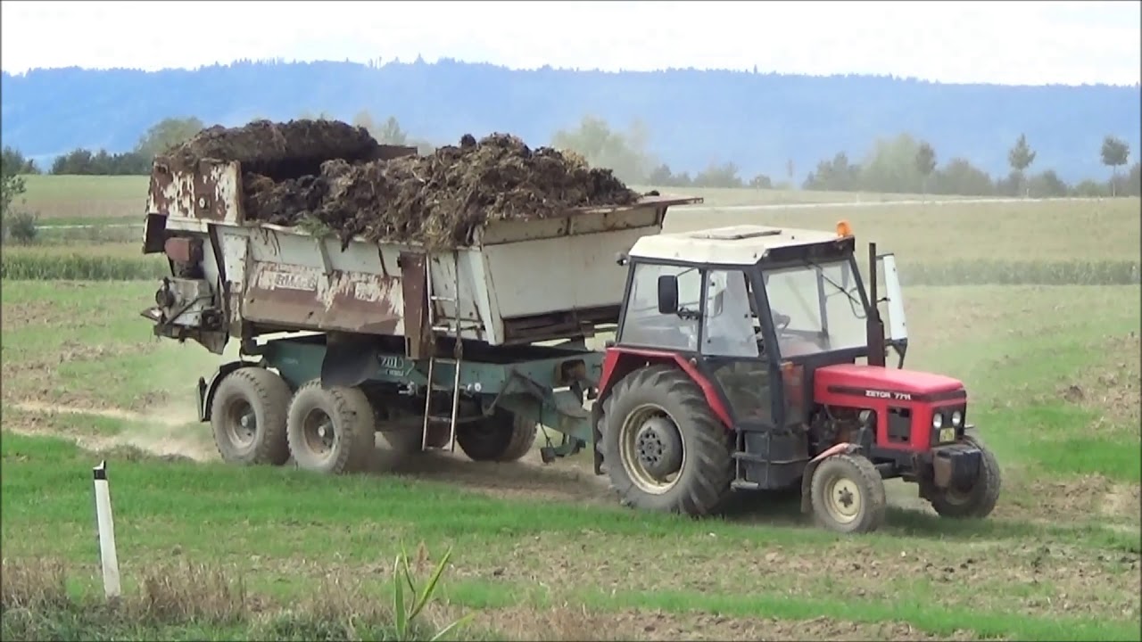 Zetor 7711 s rozmetadlem RMA 8 a Merlo