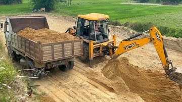 JCB Backhoe Loader Cutting Mud and Loading Dump Truck | Heavy Machinery at Work