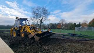 1989 jcb 3cx grey cab sitemaster digging out for an access track