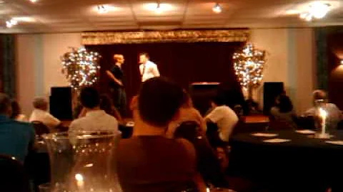 Suzie and Sara on stage with David McCreary