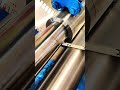Rollers press sheet clean, crisp rhythm of morning metal forming craft