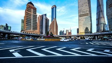 VideoVault Stock Video: Shanghai China roundabout traffic time lapse by day