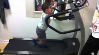 A 2 years old baby run in a treadmill