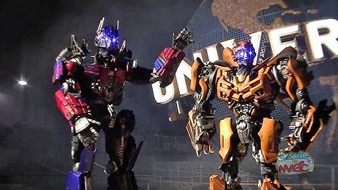 Optimus Prime and Bumblebee walk around Universal Orlando for Transformers: The Ride 3D announcement