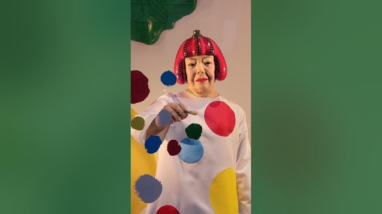 Kusama painting polka dots at the Louis Vuitton flagship store on Fifth  Avenue in New York 