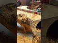 leveling huge natural wood log table surface using an electric power planer tool to make it level