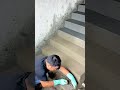 Applying smooth cement mortar on concrete staircase steps carefully