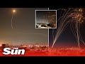 Israel's Iron Dome defence intercepts scores of Gaza rockets in skies above Tel Aviv