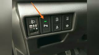 What is this button in the car? Parking sensors.