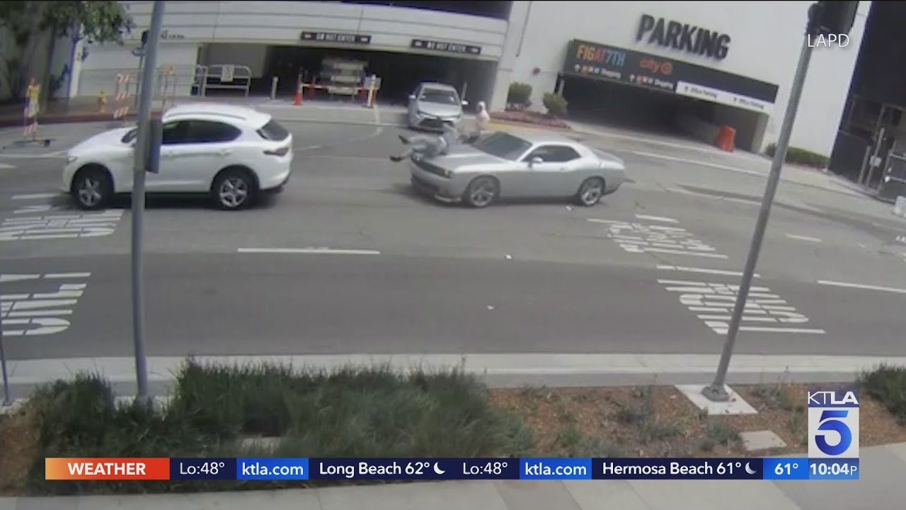 Woman run over while fleeing robbers in downtown Los Angeles - YouTube