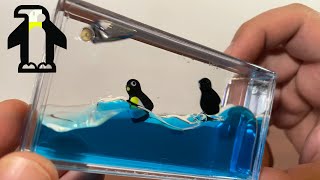 Liquid Penguin Paperweight with Wave Motion  Gadgetify