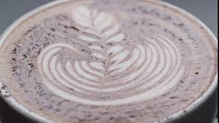 latte leaf drawing in a cup macro close up screenshot 1