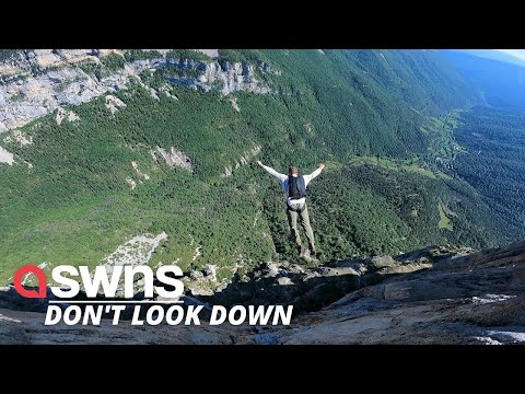 Man base jumps from 500-METER-HIGH CLIFF | SWNS