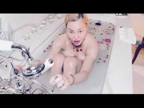 'Covid is the great equaliser' says Madonna from a petal filled bath