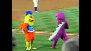 Famous Chicken battles Barney in a dance-off!