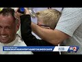 'Buzz for Bravery': Dozens shave heads in fight for childhood cancer