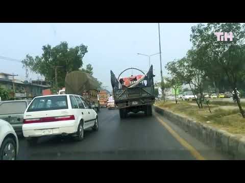 Guy Relaxes on Makeshift Hammock on Truck While it Moves on Road