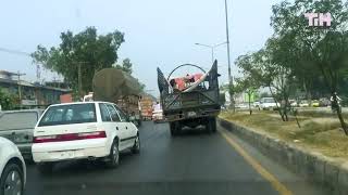 Guy Relaxes on Makeshift Hammock on Truck While it Moves on Road