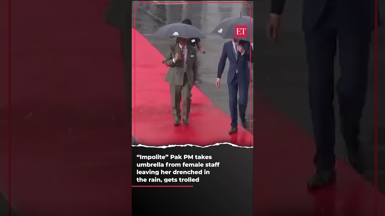 "Impolite" Pak PM takes umbrella from female staff, leaving her drenched in the rain, gets trolled