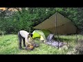 Solo tent camping in rain with a cozy warm campfire  beautiful scenery 