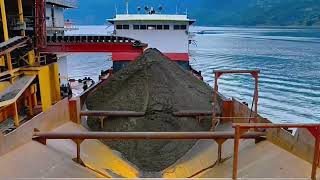 the whole process of loading sand onto the barge.  it took 8 hours to complete
