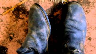 wiggling toes in old tarpaulin russian boots