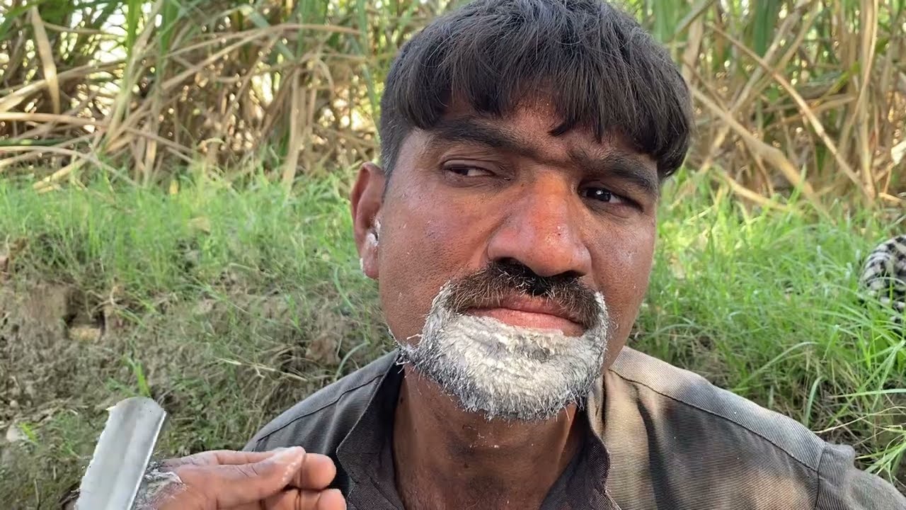 Beard Haircut with a golden scissor