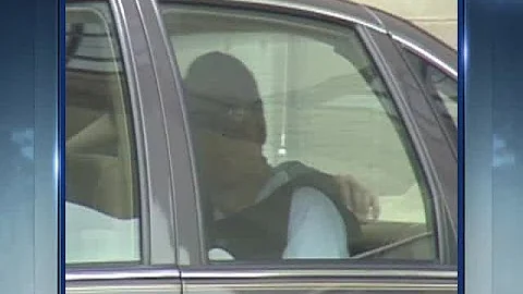Terry Nichols being loaded into car