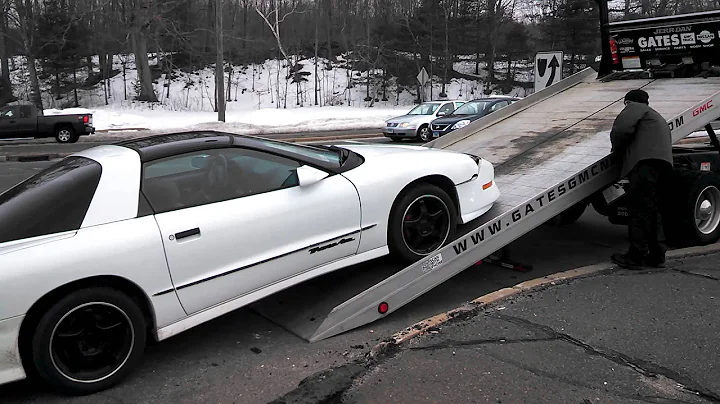 Trans Am being towed.