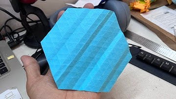 How to fold a triangular grid on a hexagon