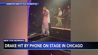 Fan throws cell phone at Drake as he performs on stage, hitting him