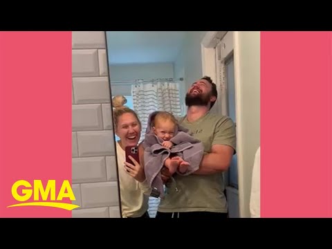 Family makes funny faces into mirror before bursting into laughter