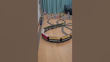 Two LEGO train loops with a bridge and a quadruple crossover!