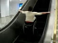 Man In Wheel Chair Falls Down Esculator ( escalator )