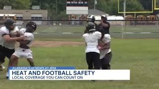 High school football teams battling heat
