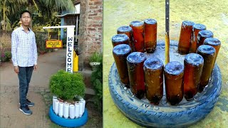 Recycling old tires and glass bottles into flower pot for garden / Nameplate with flower container.