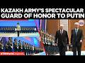 WATCH: Putin and Tokayev Review Guard Of Honor As Military Band Welcomes Russian President