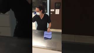 Folding a surgical towel and fenestration drape-skill 2