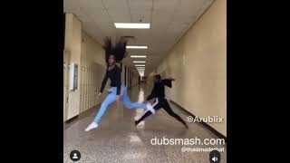 girls dancing in school hallway and doing a split