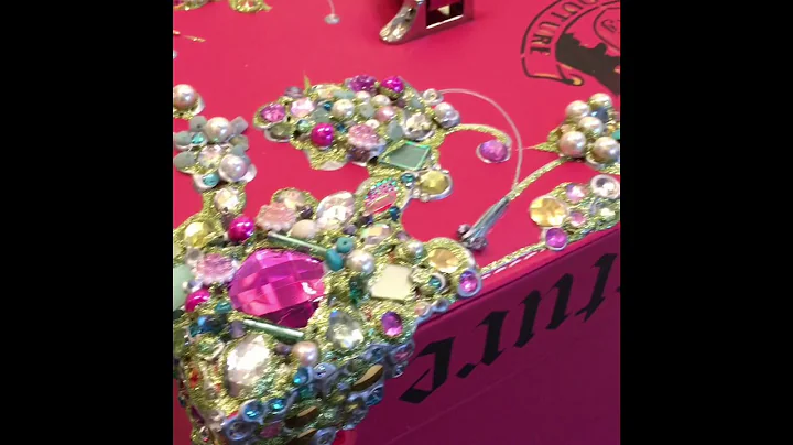 Annie Newman decorates a make up case for Juicy Co...