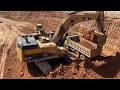 Caterpillar 365C Excavator Loading Trucks